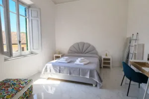 Camera da letto con lenzuola bianche - Suite Terrace Allegra Viareggio
