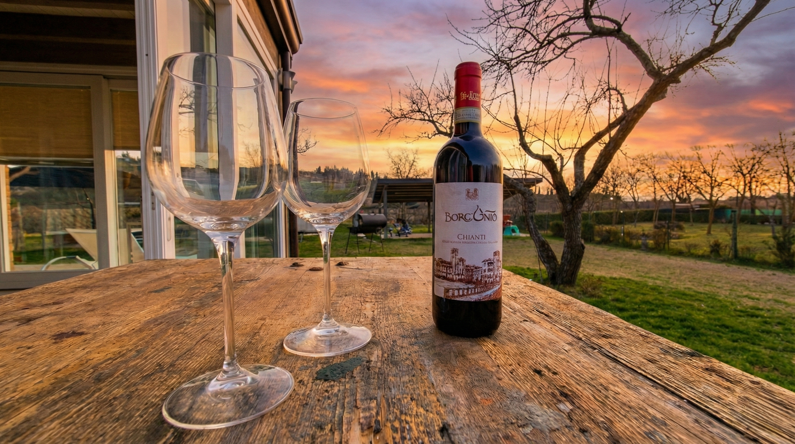 viovillas-agricamping-arezzo-vino-vista-campagna.png Vino e bicchieri con vista campagna Viovillas Arezzo - esperienza enogastronomica Toscana
